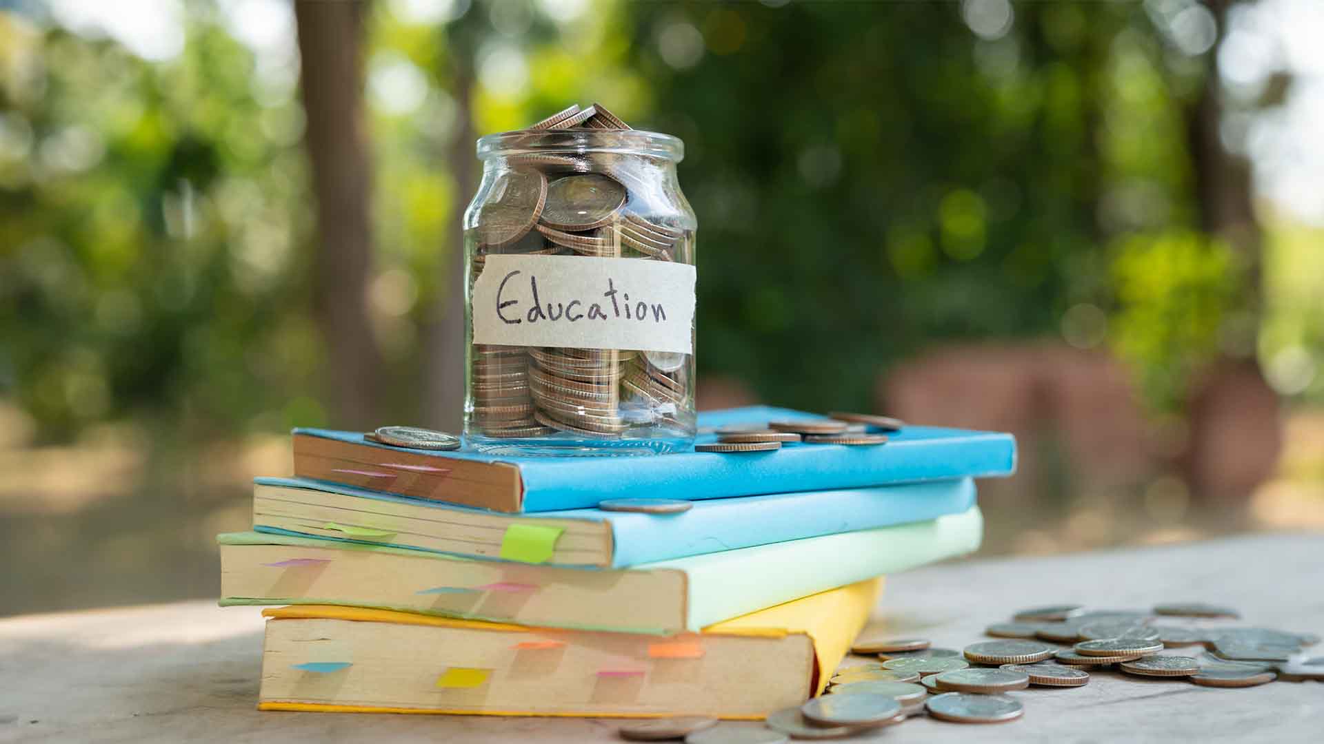 money jar of education on the books