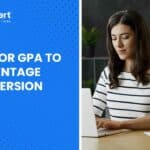 student checking GPA % on laptop